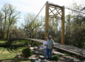 Photo by Davi Stuhlsatz/Derby Informer Larry Richardson in his backyard in front of his replica Golden Gate bridge